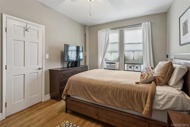 a bedroom with a bed and window