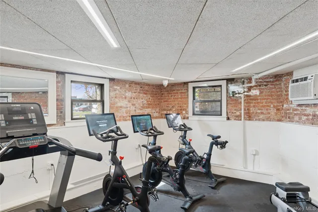 a view of a livingroom with furniture and a window