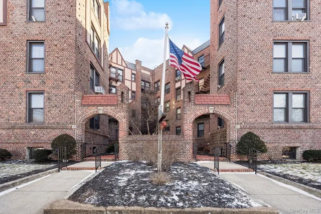 a front view of a building with large windows