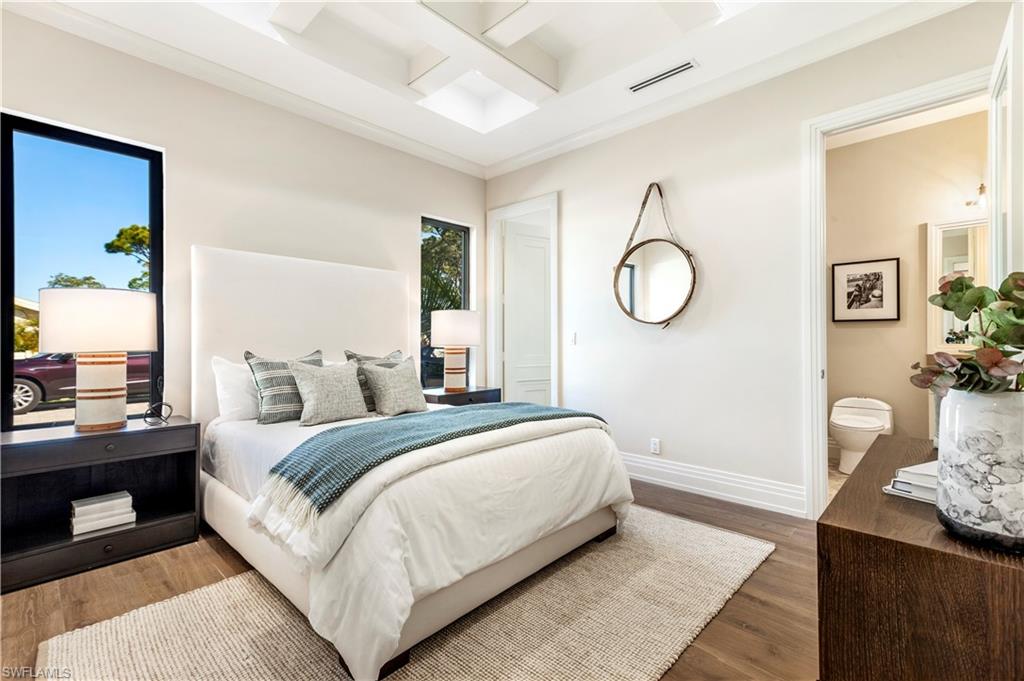437 West Street Naples, FL 34108 - Photo 25 of 35 a bedroom with a bed and window