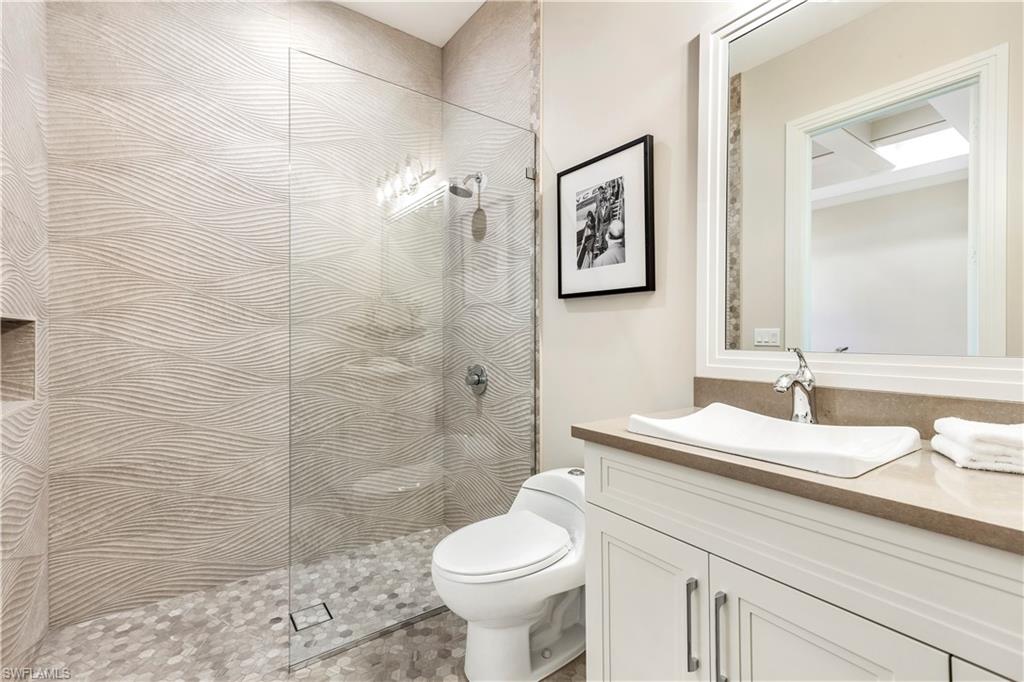 437 West Street Naples, FL 34108 - Photo 26 of 35 a bathroom with a sink toilet and shower