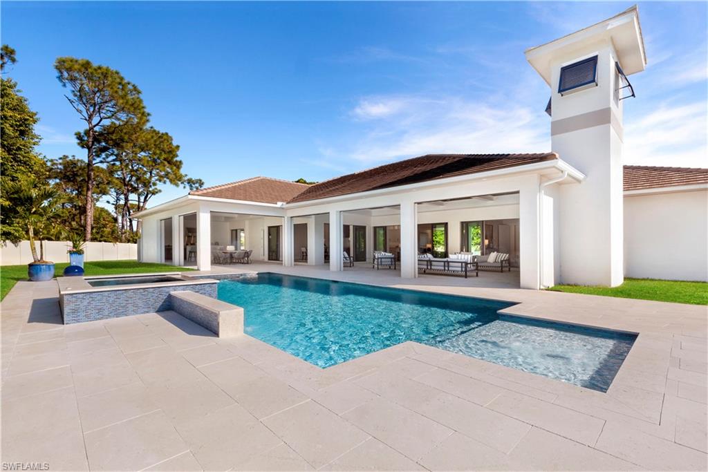 437 West Street Naples, FL 34108 - Photo 29 of 35 a front view of house with yard and green space