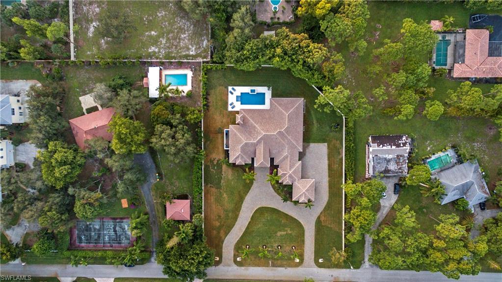 437 West Street Naples, FL 34108 - Photo 30 of 35 an aerial view of a house with a lake view