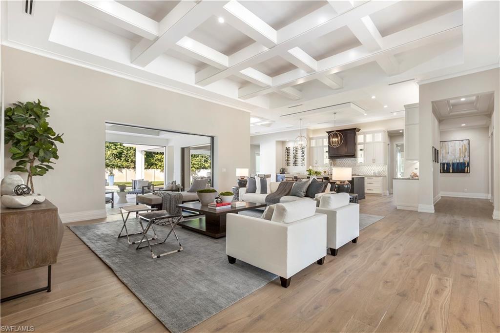 437 West Street Naples, FL 34108 - Photo 3 of 35 a living room with furniture wooden floor and a large window