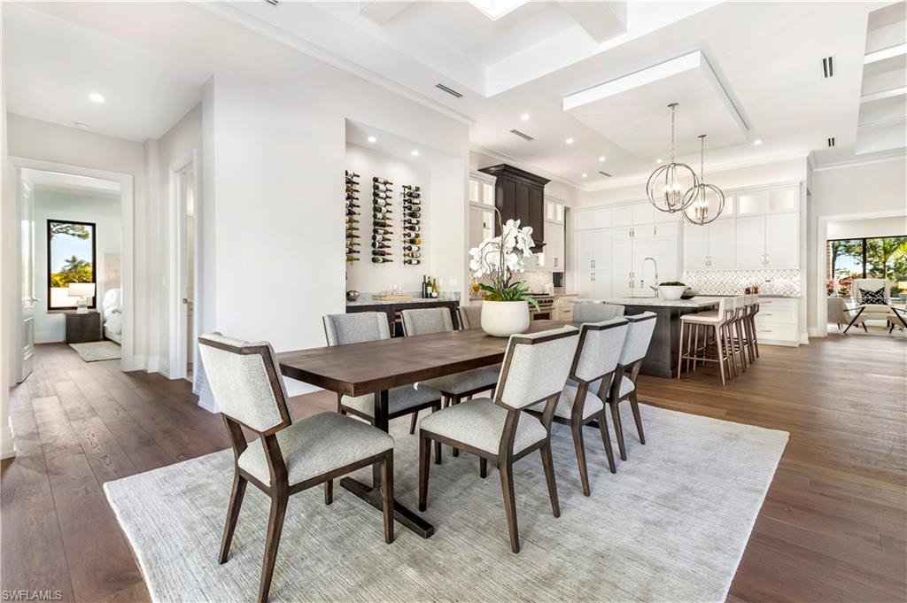 437 West Street Naples, FL 34108 - Photo 9 of 35 a dining room with livingroom view and wooden floor