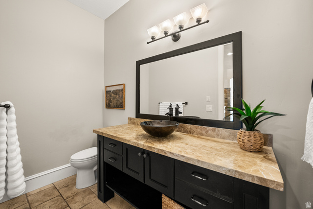 1205 North Elk Rdg Lane, Unit 202 Alpine, UT 84004 - Photo 25 of 88 Powder room featuring a dark wood vanity with a vessel sink, a light-toned stone countertop, and a large framed mirror