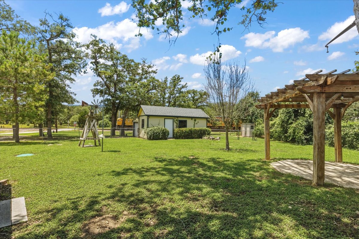 250 Hickory Drive Elgin, TX 78621 - Photo 27 of 37 a view of a house with a big yard and large trees
