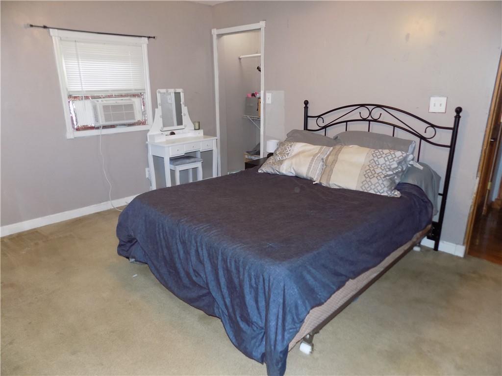 1067 Silver Lane McKees Rocks, PA 15136 - Photo 23 of 25 a bedroom with a bed and window