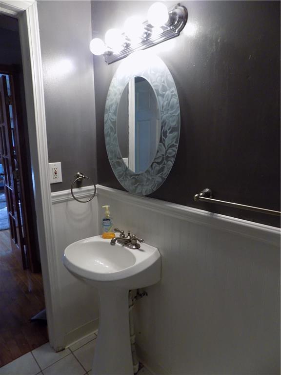1067 Silver Lane McKees Rocks, PA 15136 - Photo 24 of 25 a bathroom with a sink and a mirror
