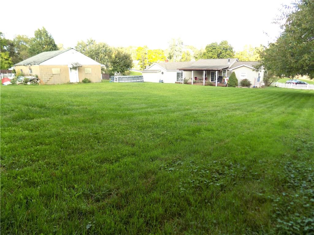 1067 Silver Lane McKees Rocks, PA 15136 - Photo 5 of 25 a view of a house with a yard and trees