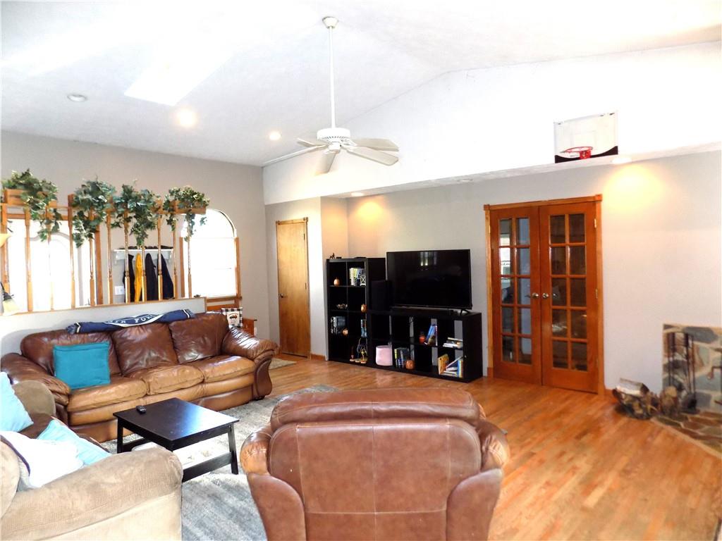 1067 Silver Lane McKees Rocks, PA 15136 - Photo 8 of 25 a living room with furniture and a flat screen tv