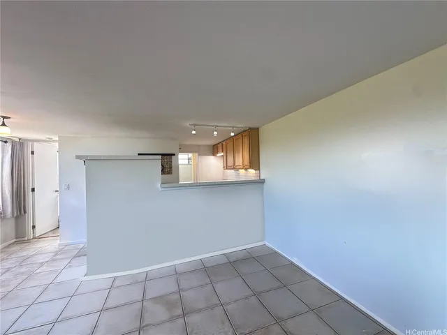 a view of an empty room and closet