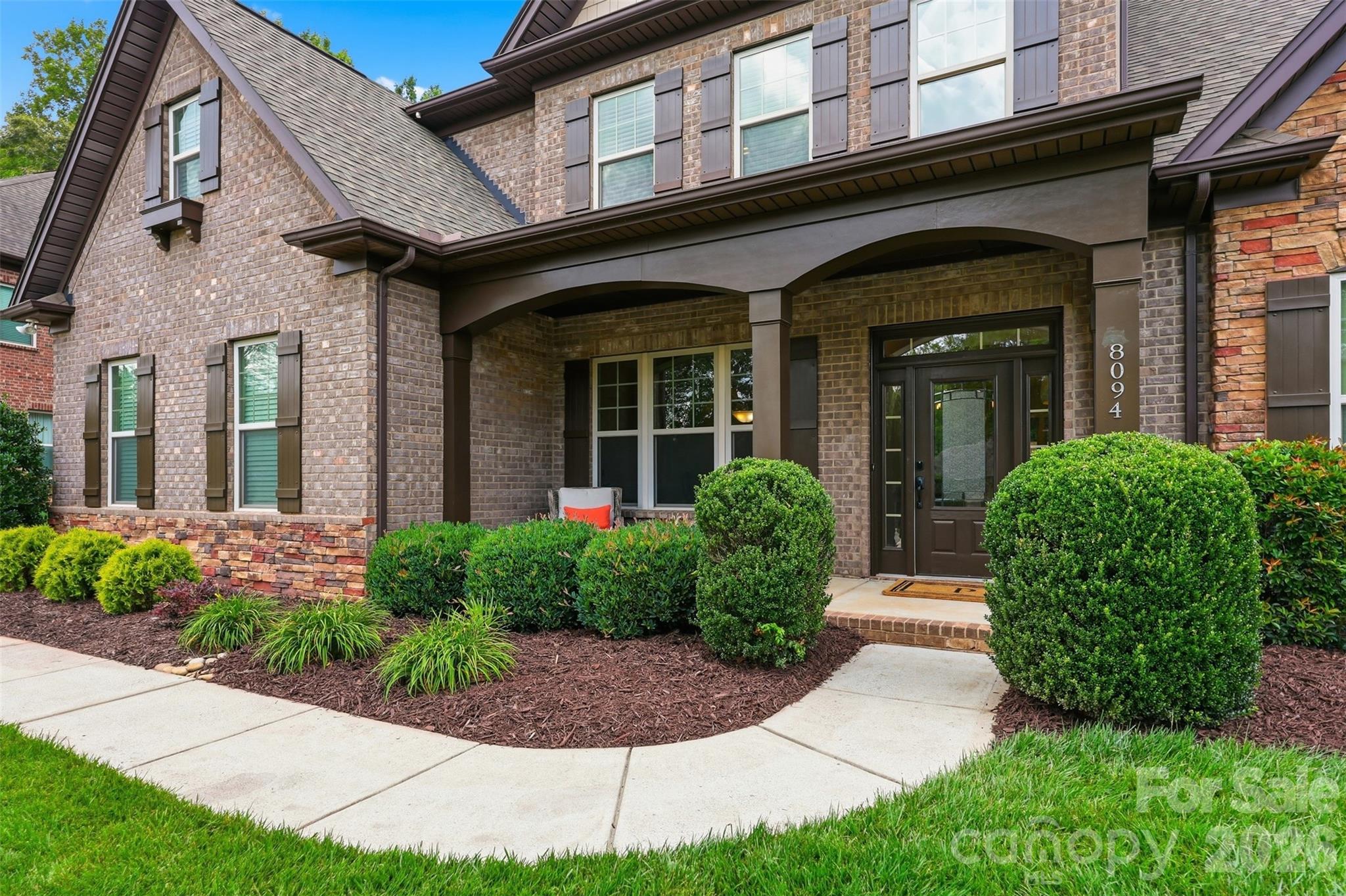 8094 Clems Branch Road Indian Land, SC 29707 - Photo 31 of 38 a front view of a house with garden