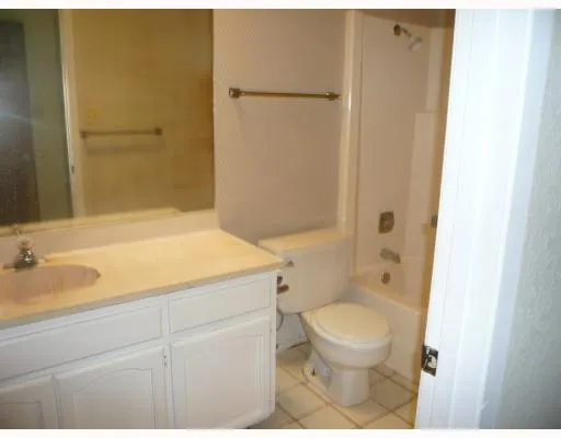 a bathroom with a bathtub and a sink