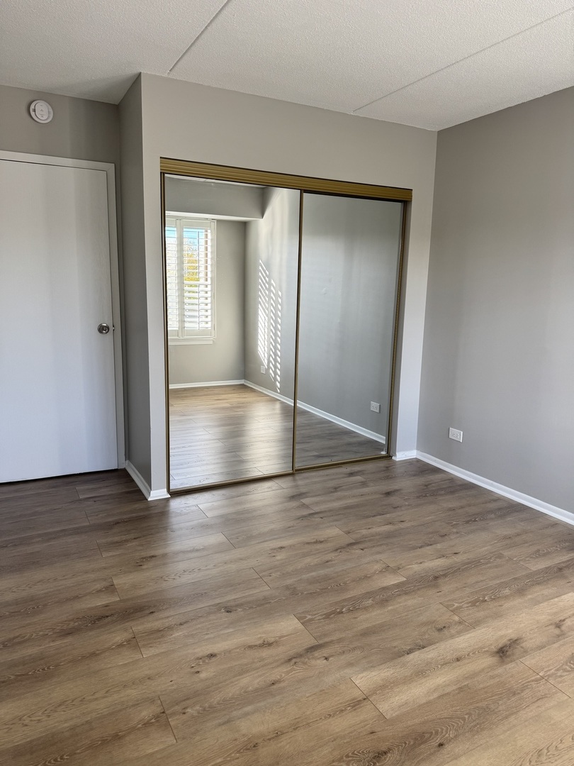 500 Park Avenue, Unit 433 Calumet City, IL 60409 - Photo 12 of 22 a view of empty room with wooden floor