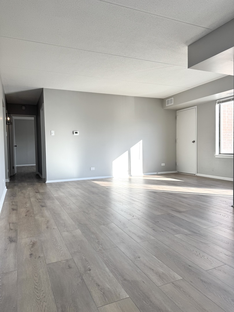 500 Park Avenue, Unit 433 Calumet City, IL 60409 - Photo 6 of 22 a view of empty room with wooden floor