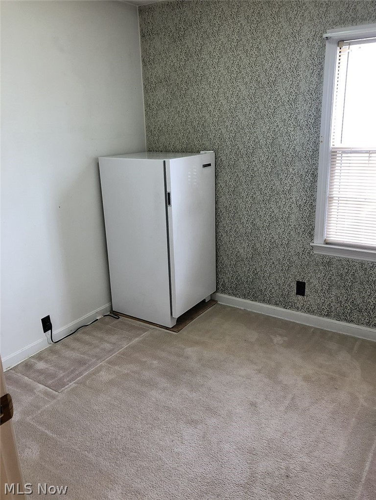 821 Reed Avenue Akron, OH 44306 - Photo 14 of 21 Bedroom number 3 is the smallest and is currently used for a storage room and freezer space.