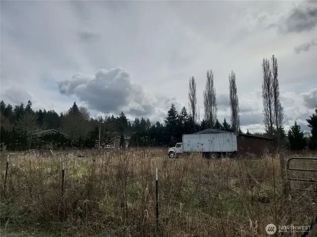 a view of a lake with houses in the back