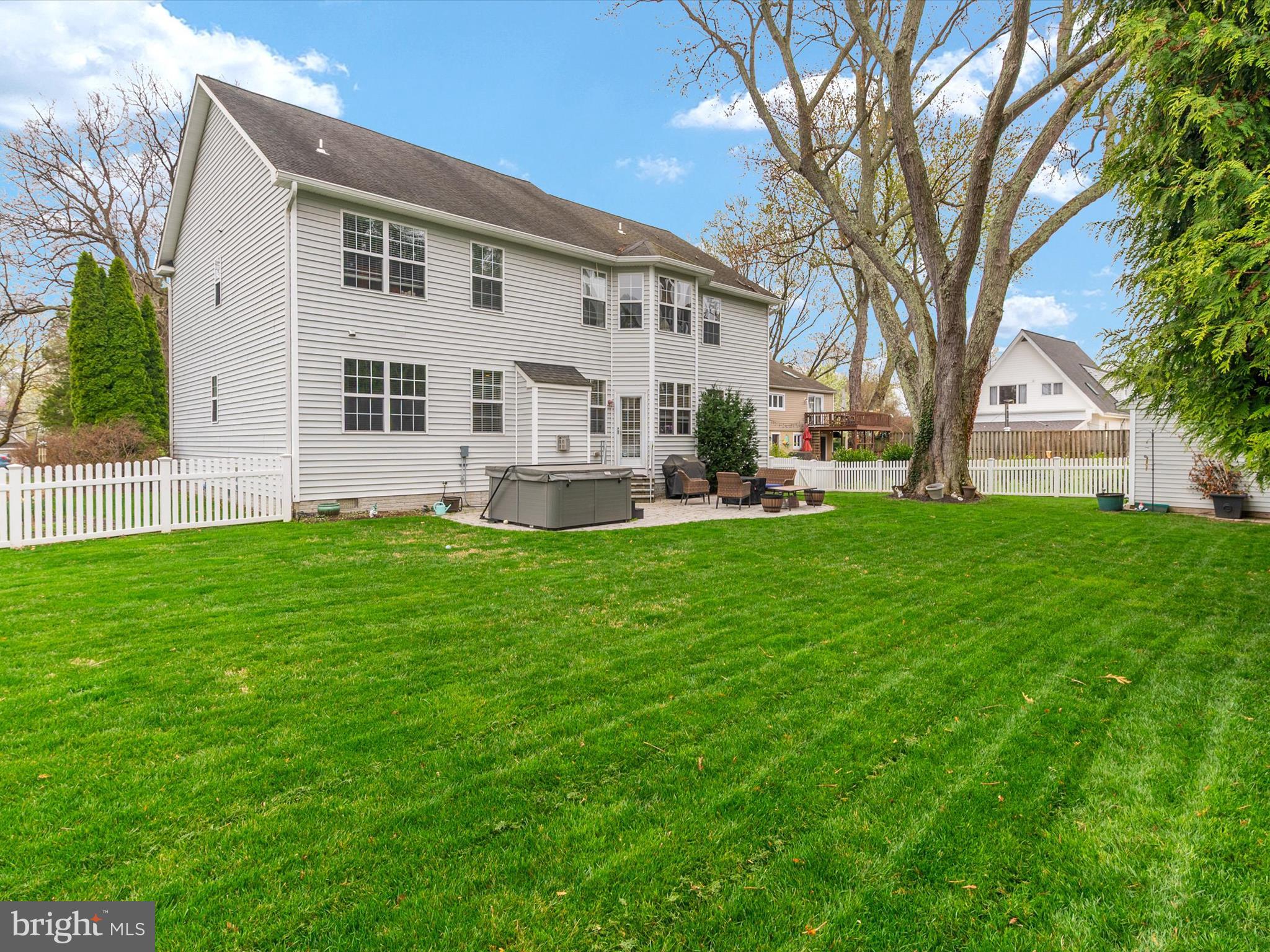 688 Red Cedar Road Annapolis, MD 21409 - Photo 45 of 54 a front view of a house with a yard and trees