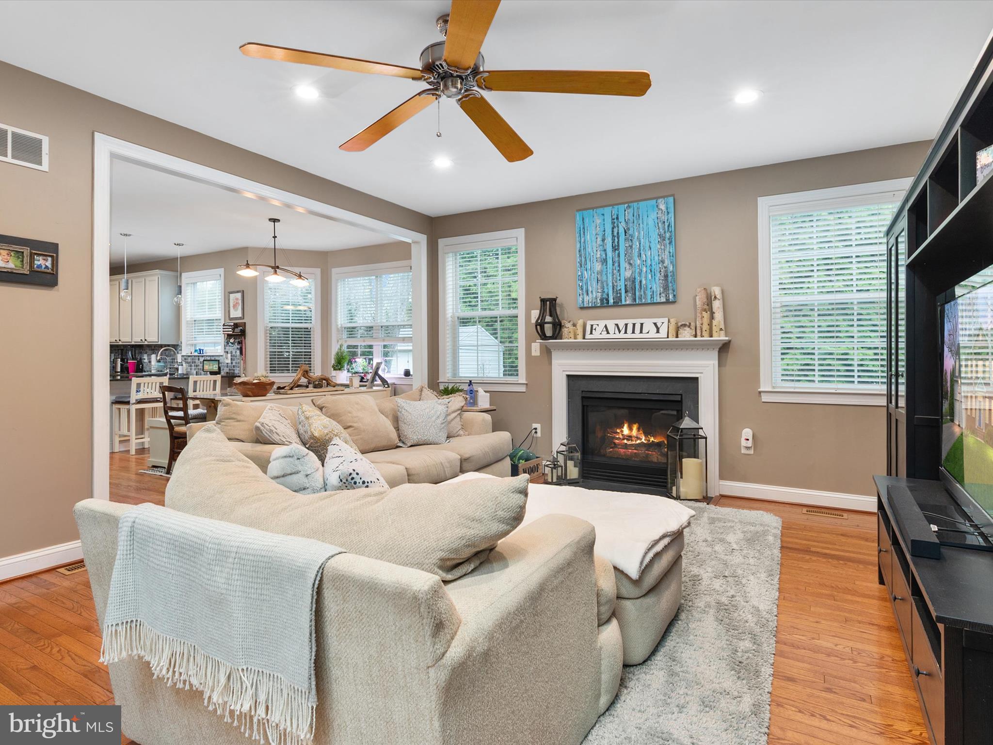688 Red Cedar Road Annapolis, MD 21409 - Photo 6 of 54 a living room with furniture large window and a fireplace