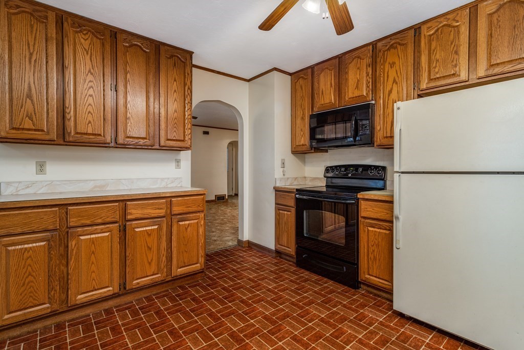 18 Page Street Shirley, MA 01464 - Photo 13 of 41 a kitchen with stainless steel appliances granite countertop a refrigerator a stove top oven a sink and dishwasher
