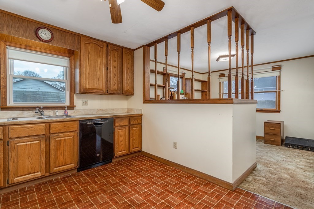 18 Page Street Shirley, MA 01464 - Photo 14 of 41 a kitchen with stainless steel appliances granite countertop a stove sink and cabinets