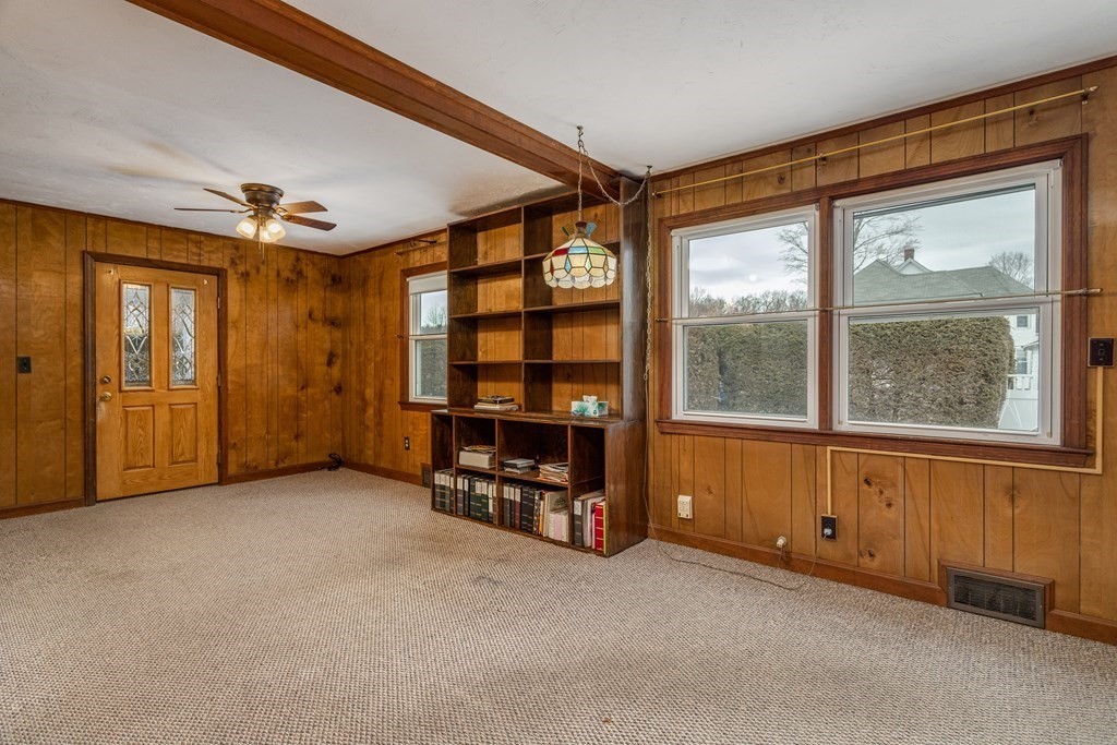 18 Page Street Shirley, MA 01464 - Photo 16 of 41 an empty room with windows closet and flat screen tv
