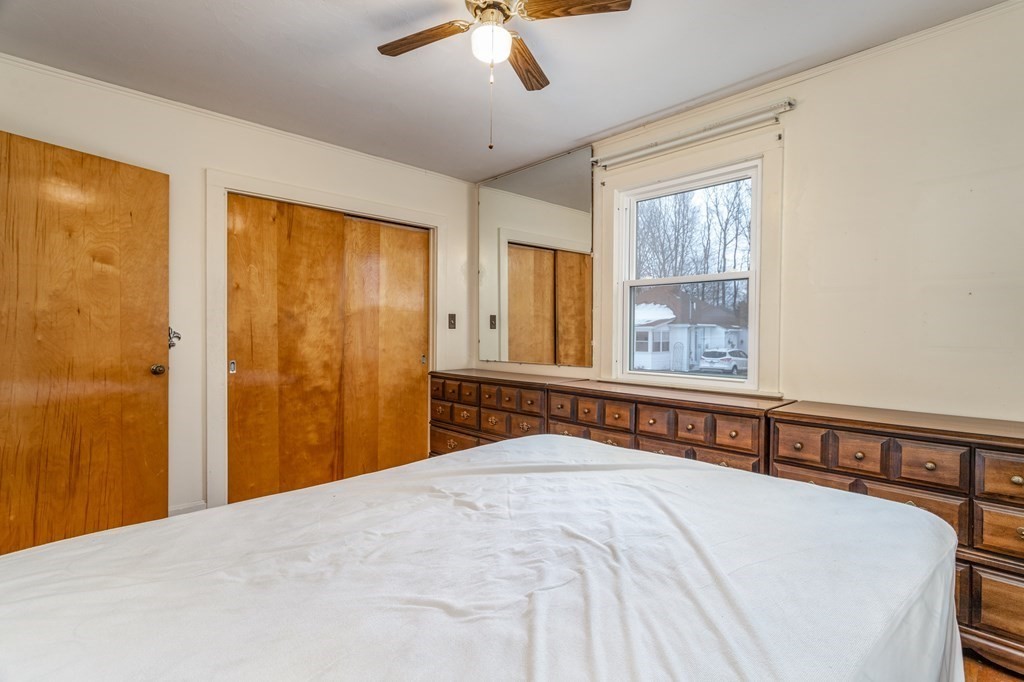 18 Page Street Shirley, MA 01464 - Photo 19 of 41 a bedroom with a bed and a window