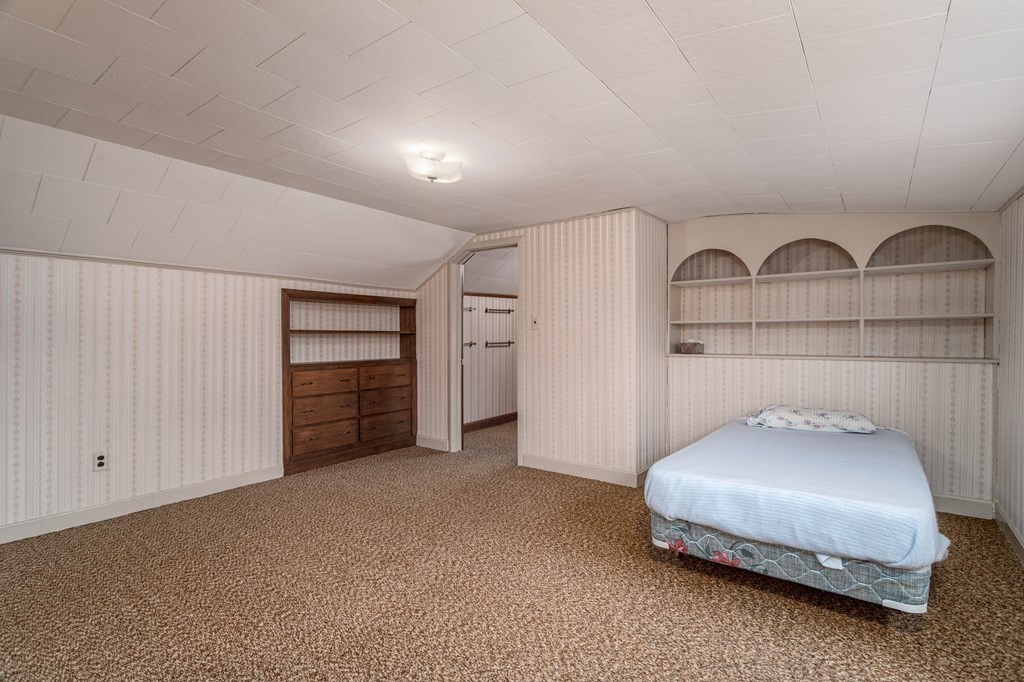 18 Page Street Shirley, MA 01464 - Photo 23 of 41 a bedroom with a bed and a view of cabinet