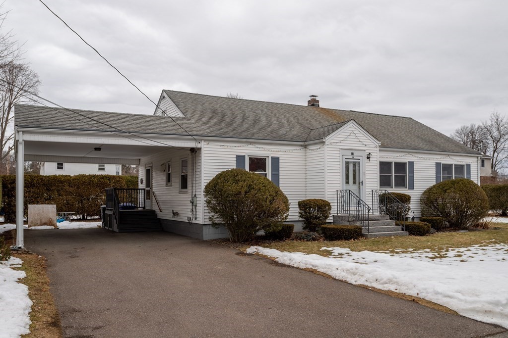 18 Page Street Shirley, MA 01464 - Photo 3 of 41 a front view of a house with a large window and parked
