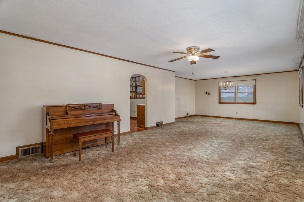 18 Page Street Shirley, MA 01464 - Photo 4 of 41 a view of a room with a piano and wooden floor