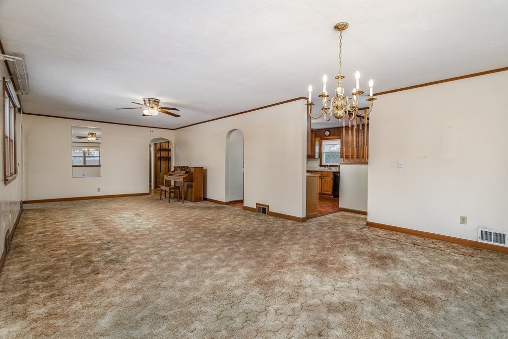 18 Page Street Shirley, MA 01464 - Photo 7 of 41 a view of a livingroom with furniture and chandelier