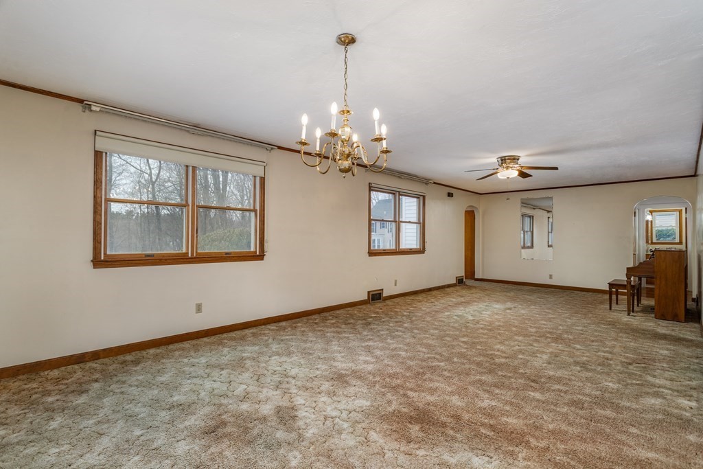18 Page Street Shirley, MA 01464 - Photo 8 of 41 a view of empty room with windows