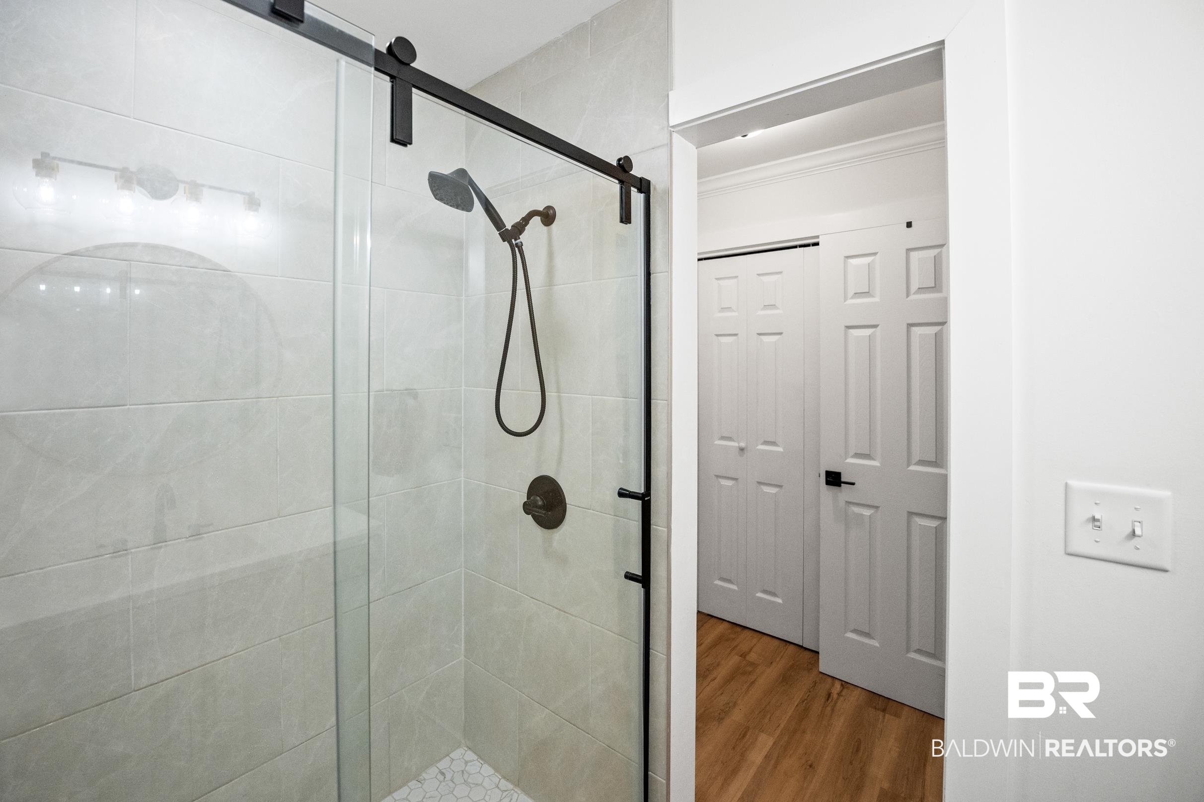 6 Wren Circle Foley, AL 36535 - Photo 43 of 55 Bathroom with a shower stall, crown molding, and wood finished floors