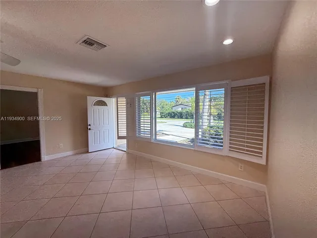 a bathroom with a shower a toilet and a sink