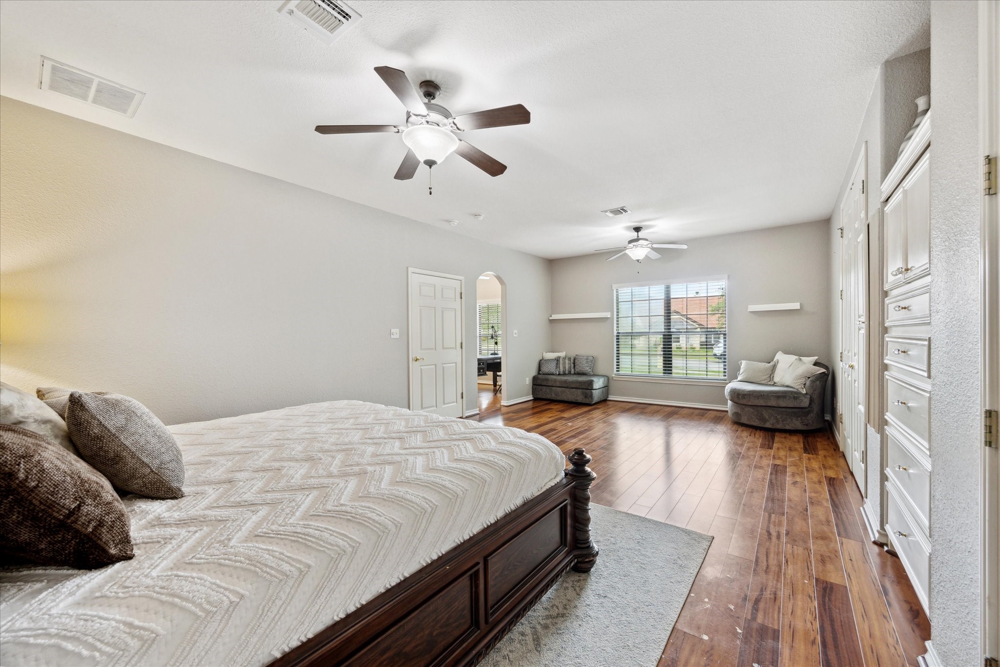 101 High Ridge Circle San Marcos, TX 78666 - Photo 20 of 31 Notice the large sitting area right in front of the double windows of your luxurious primary suite.