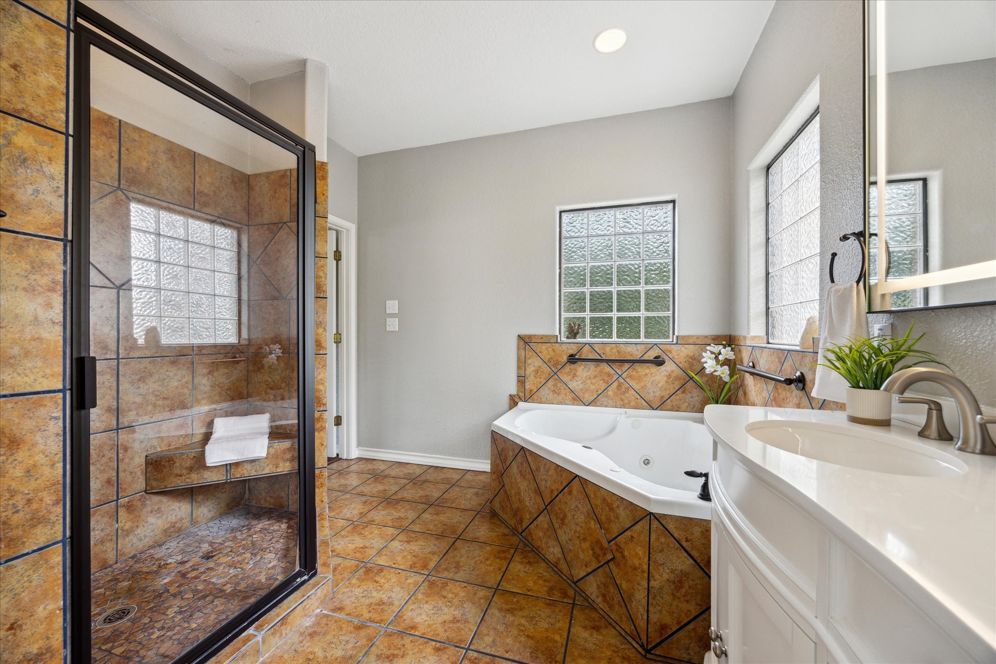101 High Ridge Circle San Marcos, TX 78666 - Photo 22 of 31 This primary ensuite even has a beautiful, large custom shower.