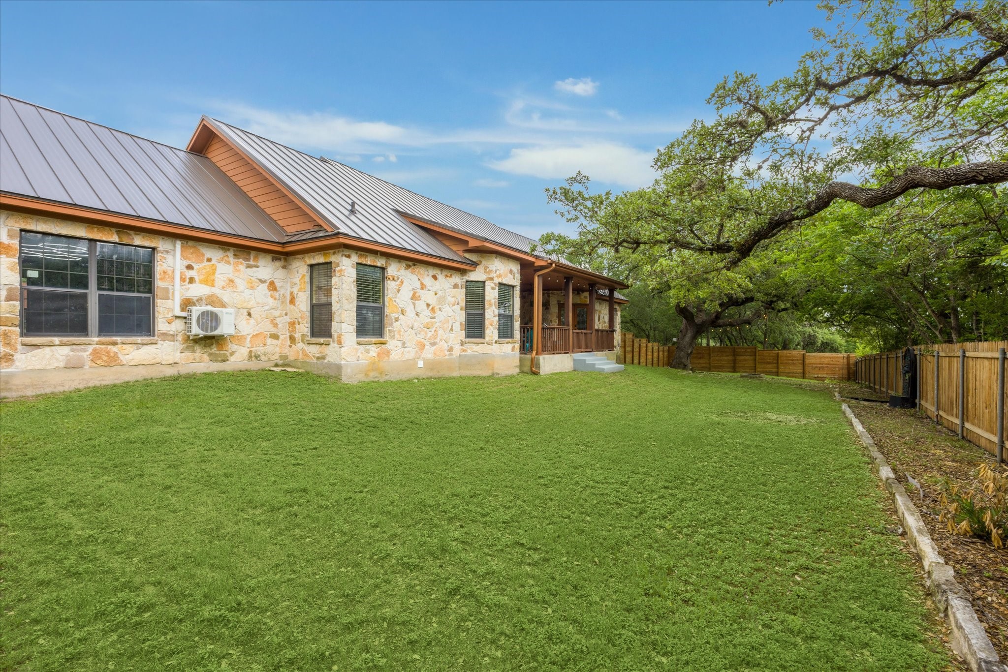 101 High Ridge Circle San Marcos, TX 78666 - Photo 30 of 31 The view of the house from the back left corner of the fenced portion of the back yard.