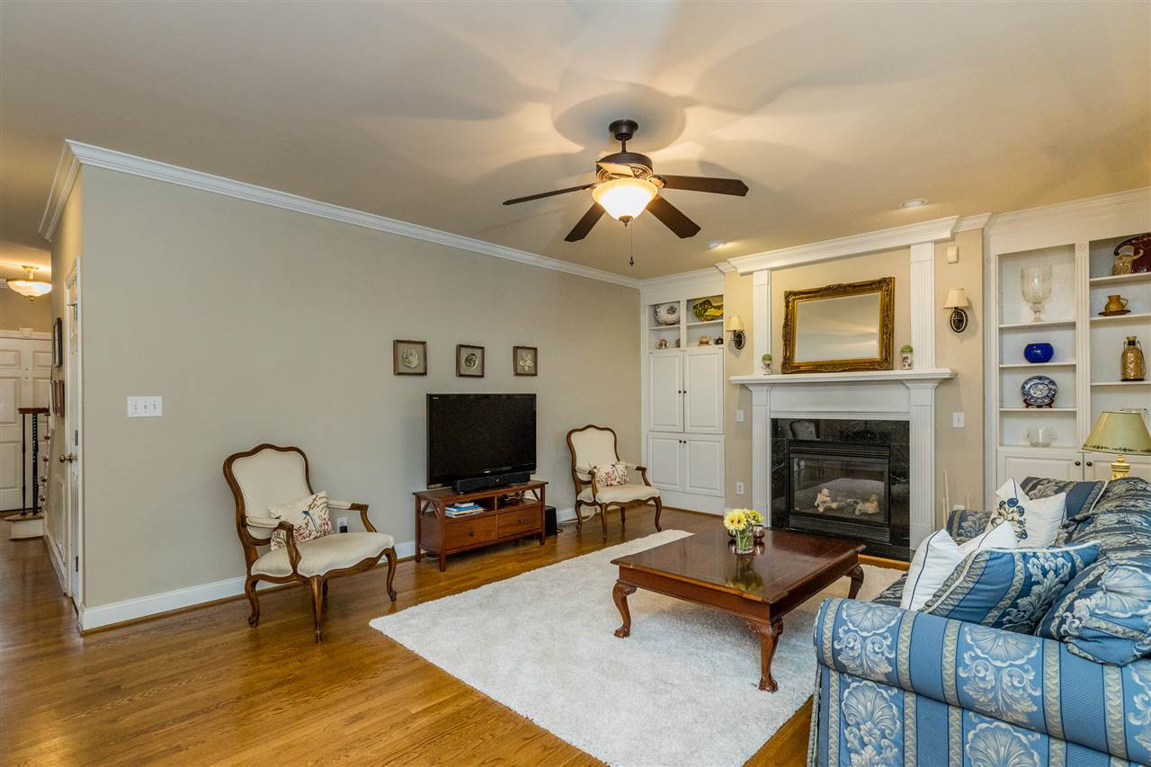 3705 Wesley Ridge Drive Apex, NC 27539 - Photo 9 of 30 Comfortable open room with gas log fireplace and built in shelving. Family Room
