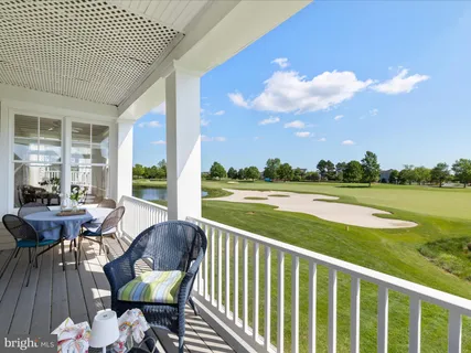 a view of a balcony with lake view and a potted plant