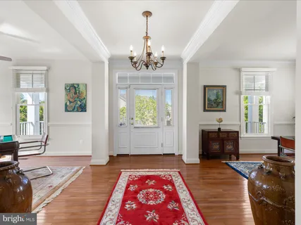 a living room with furniture a rug and a window