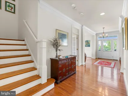 a kitchen with granite countertop a sink a stove and cabinets