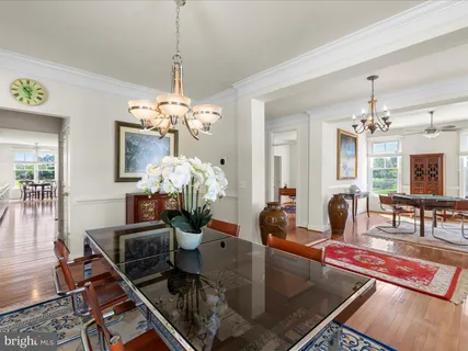 a living room with furniture a table and a large window
