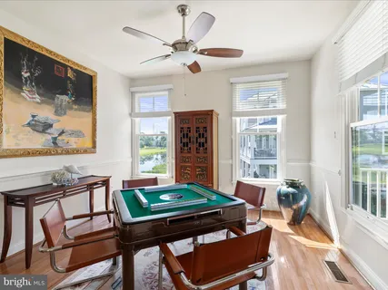 a spacious bedroom with a bed and a large window