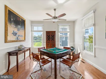 a spacious bedroom with a bed and a chandelier