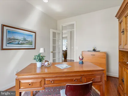 a spacious bathroom with a mirror sink and shower