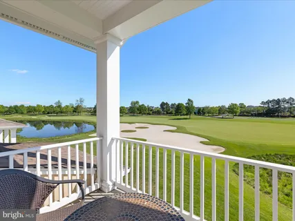 a bedroom with a bed and a lamp