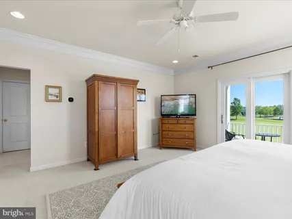 a bathroom with a sink toilet vanity and shower