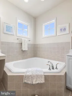 a bathroom with a sink double vanity and a mirror