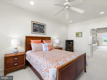 a balcony with wooden floor table and chairs